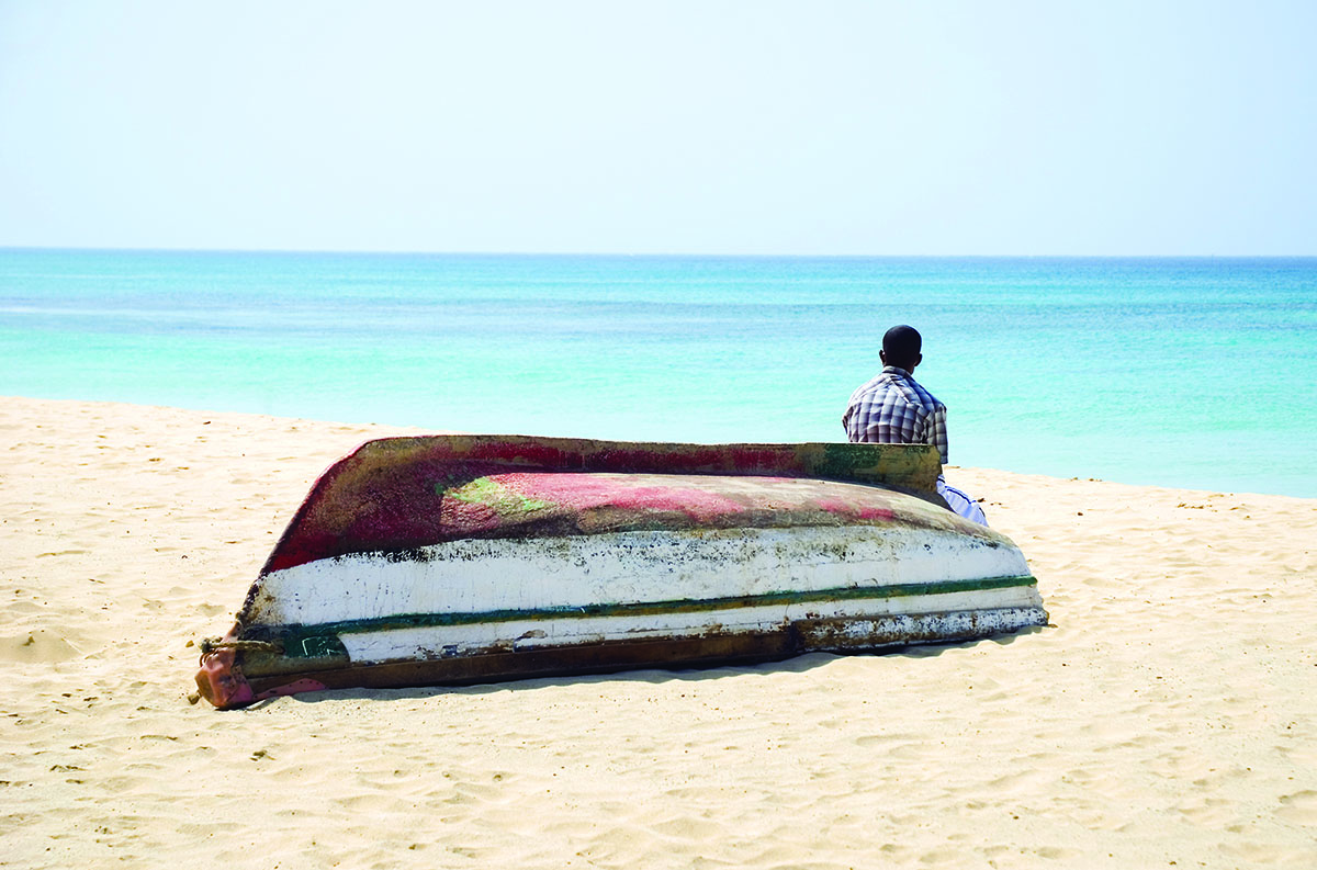 upside down boat on a beach